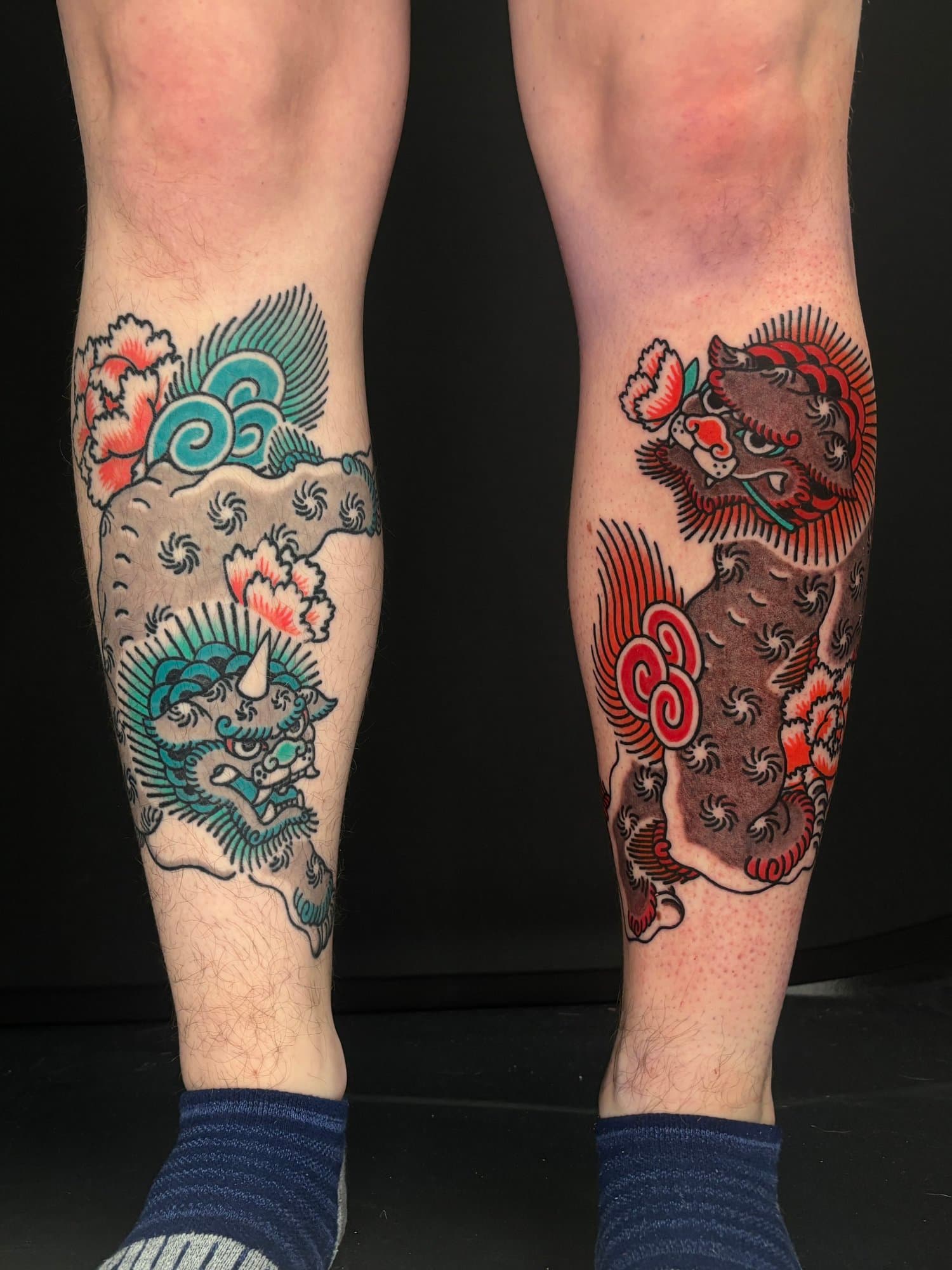 pair of foodog shishi japanese tradtional leg tattoo