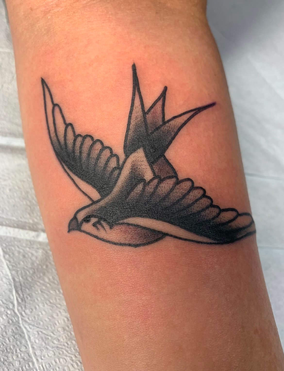 black and grey, traditional swallow tail tattoo