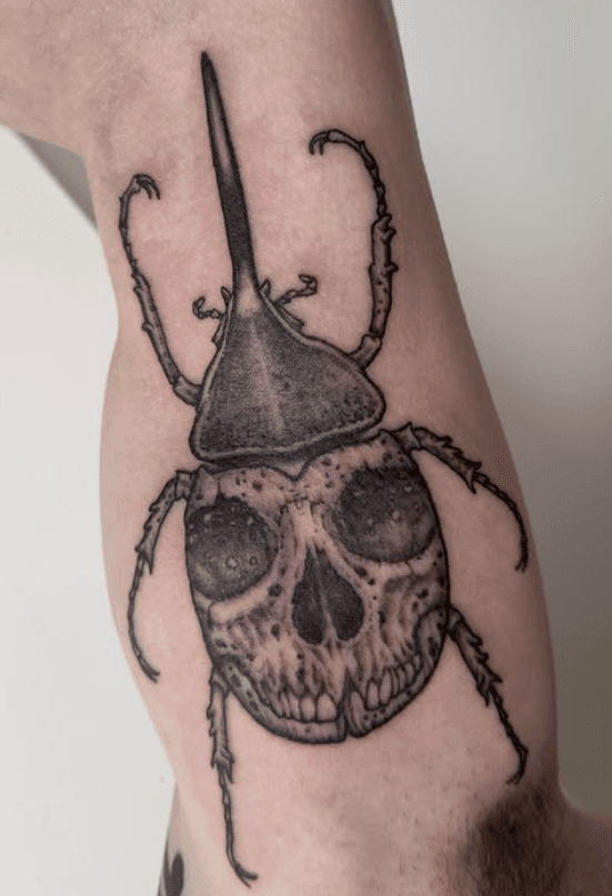 black and grey illustrative tattoo skull beetle done in toronto