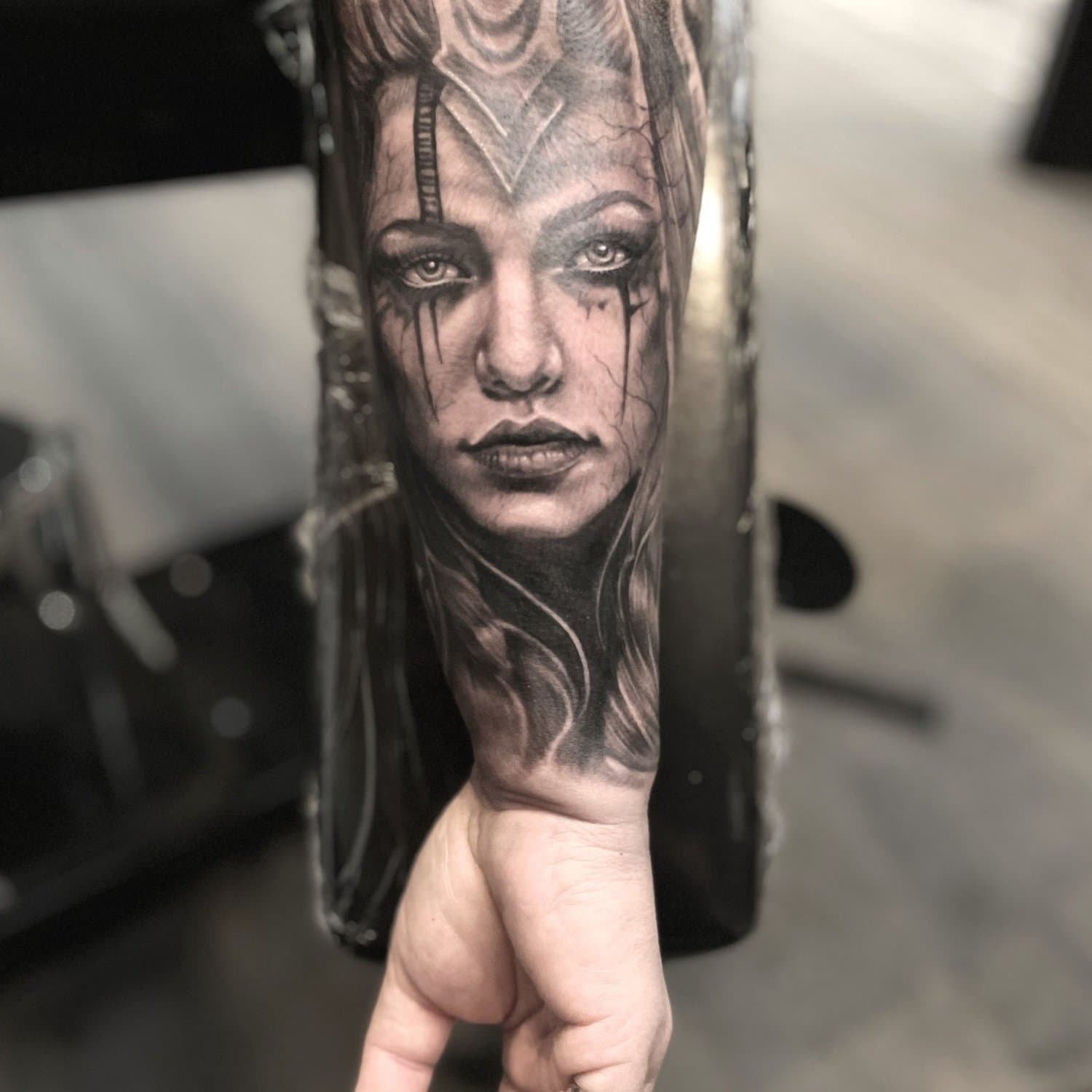 Woman warrior tattoo on back of forearm