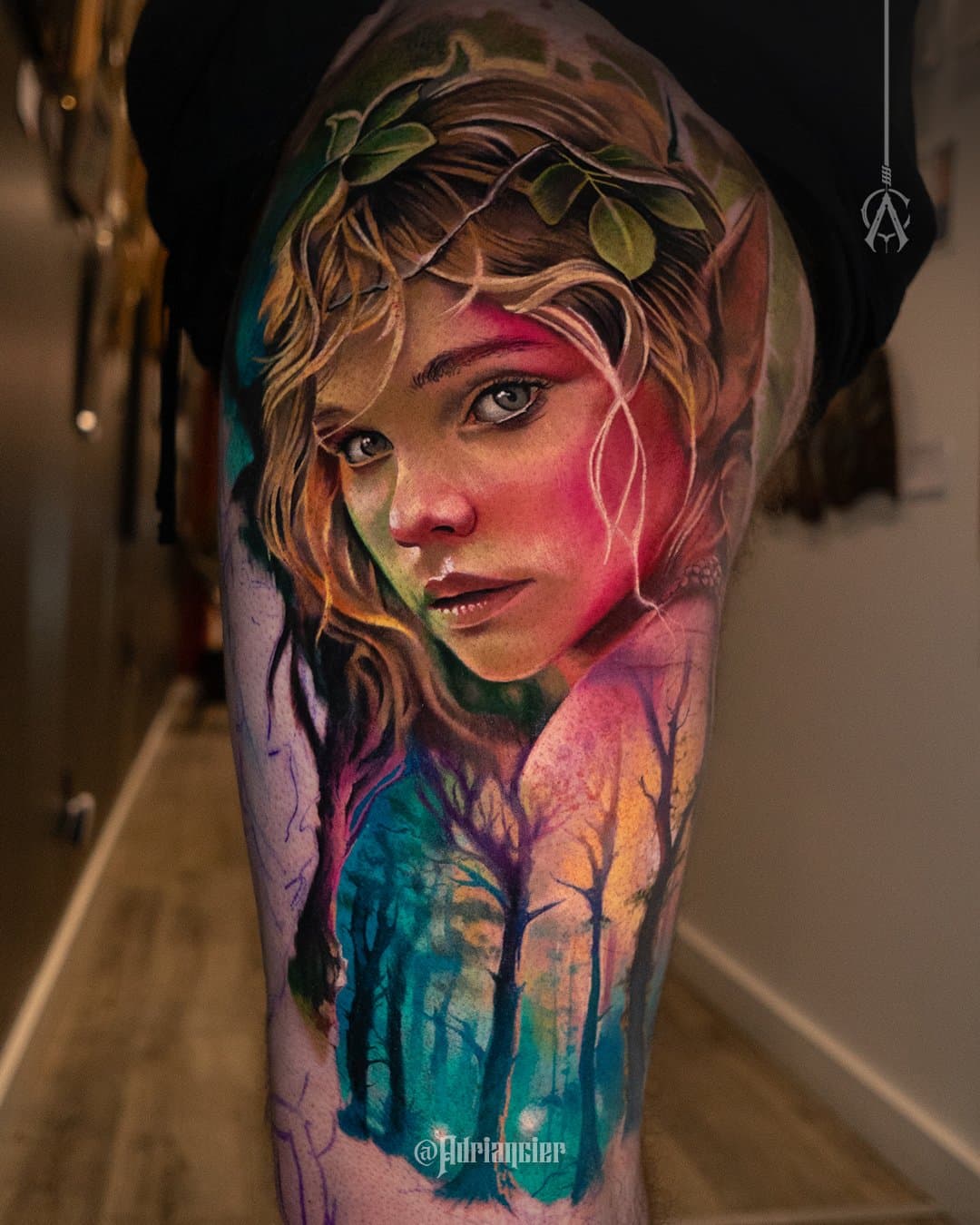 Vivid fantasy portrait above a blue-green misty forest on the upper arm
