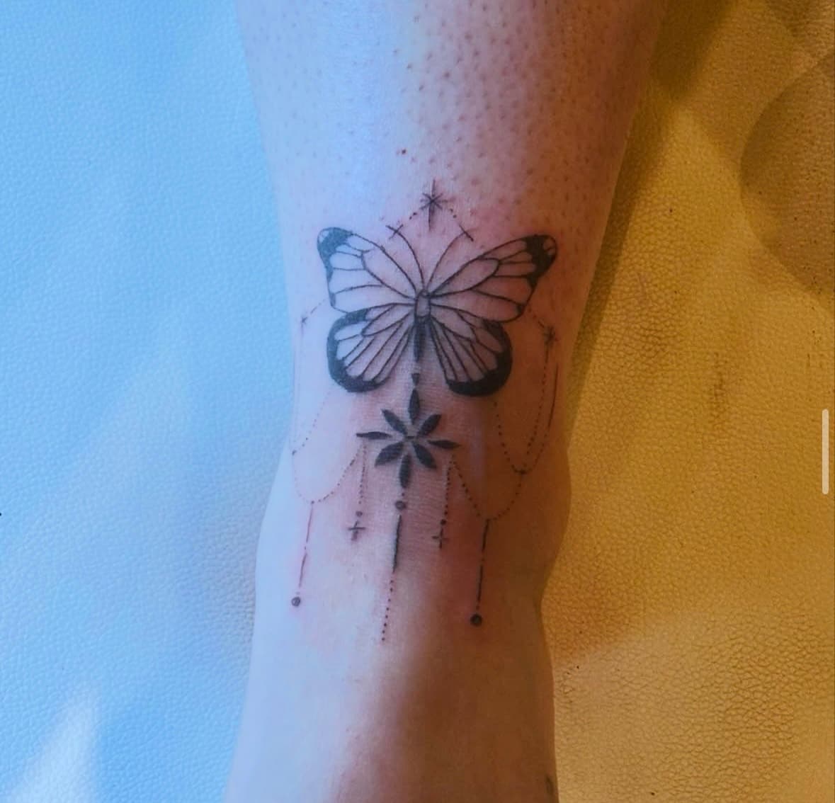 Ornamental butterfly tattoo