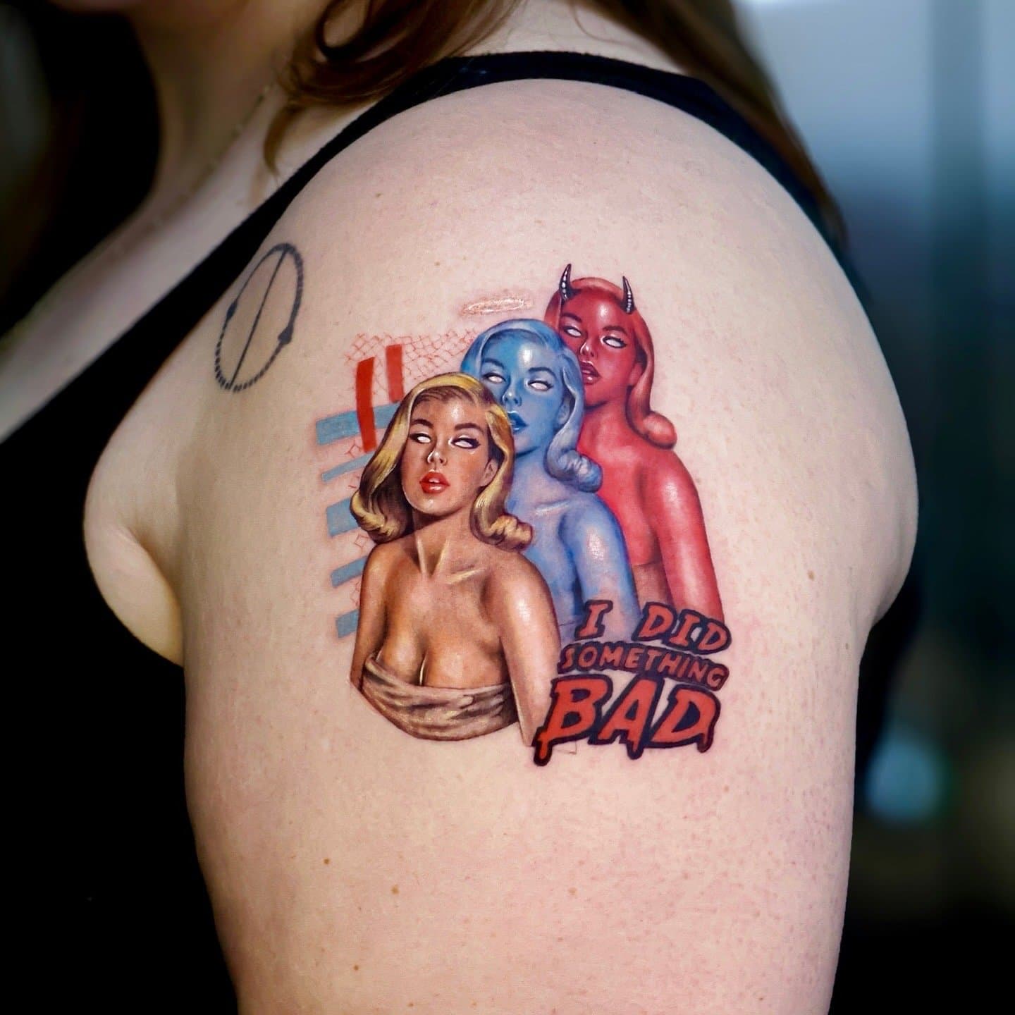 Three stylized women in tan, blue, and red with small lettering on the upper arm