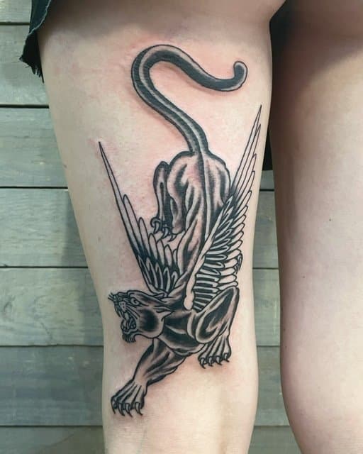black work panther with wings, back thigh tattoo