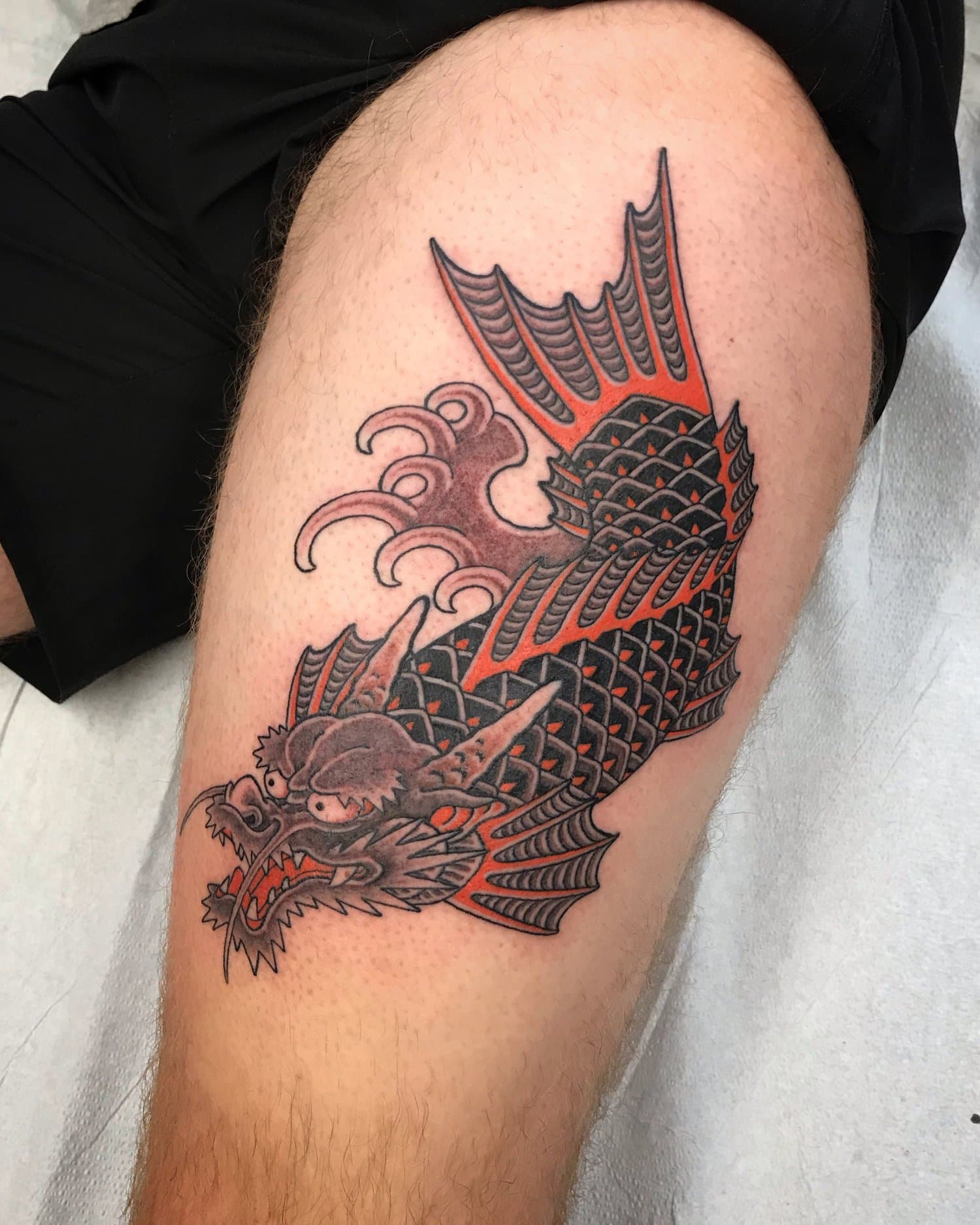 dragon koi thigh tattoo