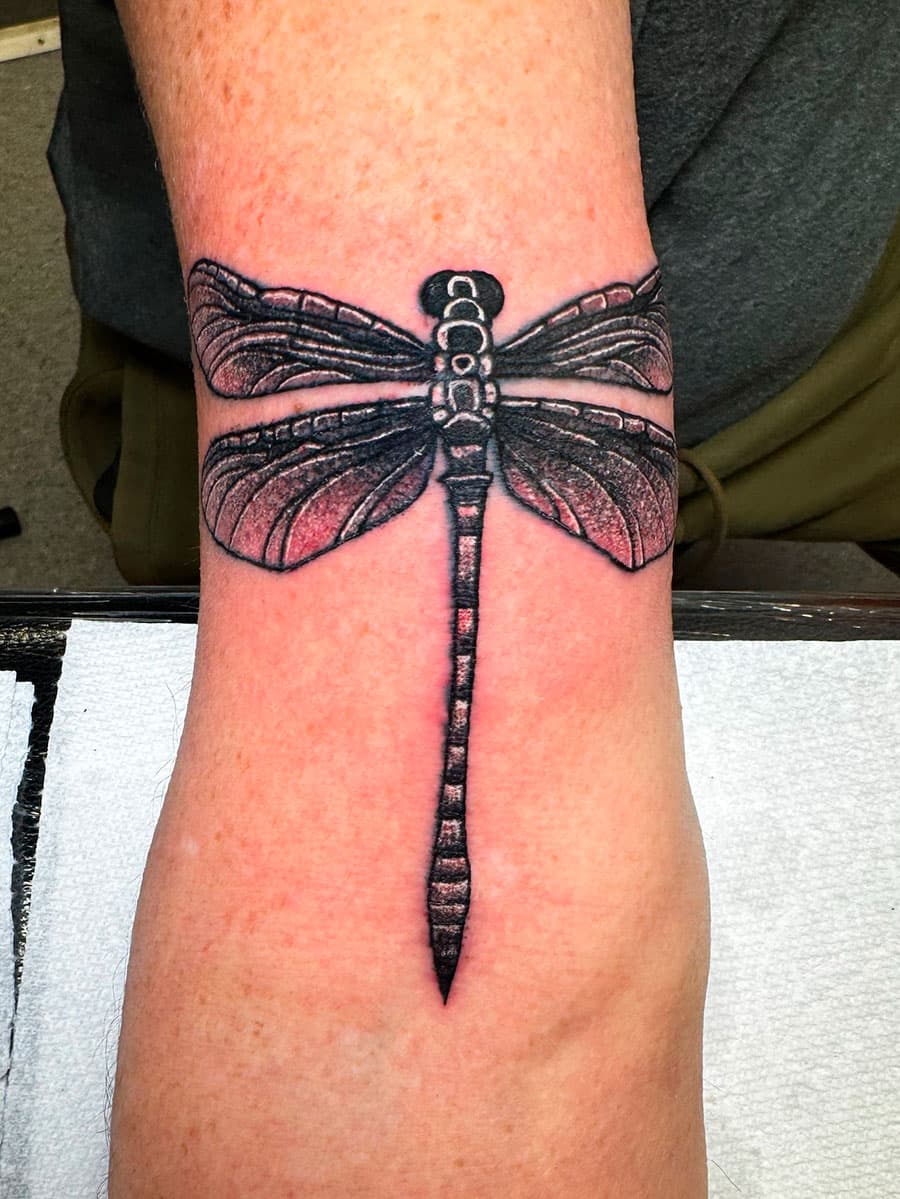 Dragonfly tattoo by Harrison Ortega