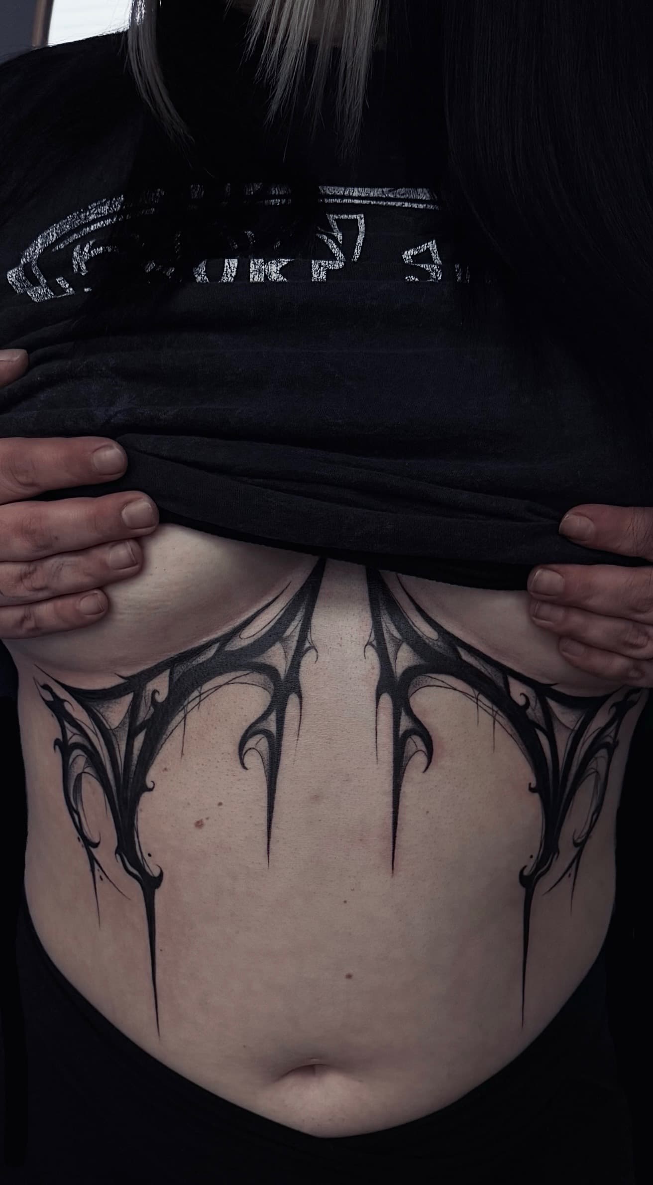 gothic stomach tattoo