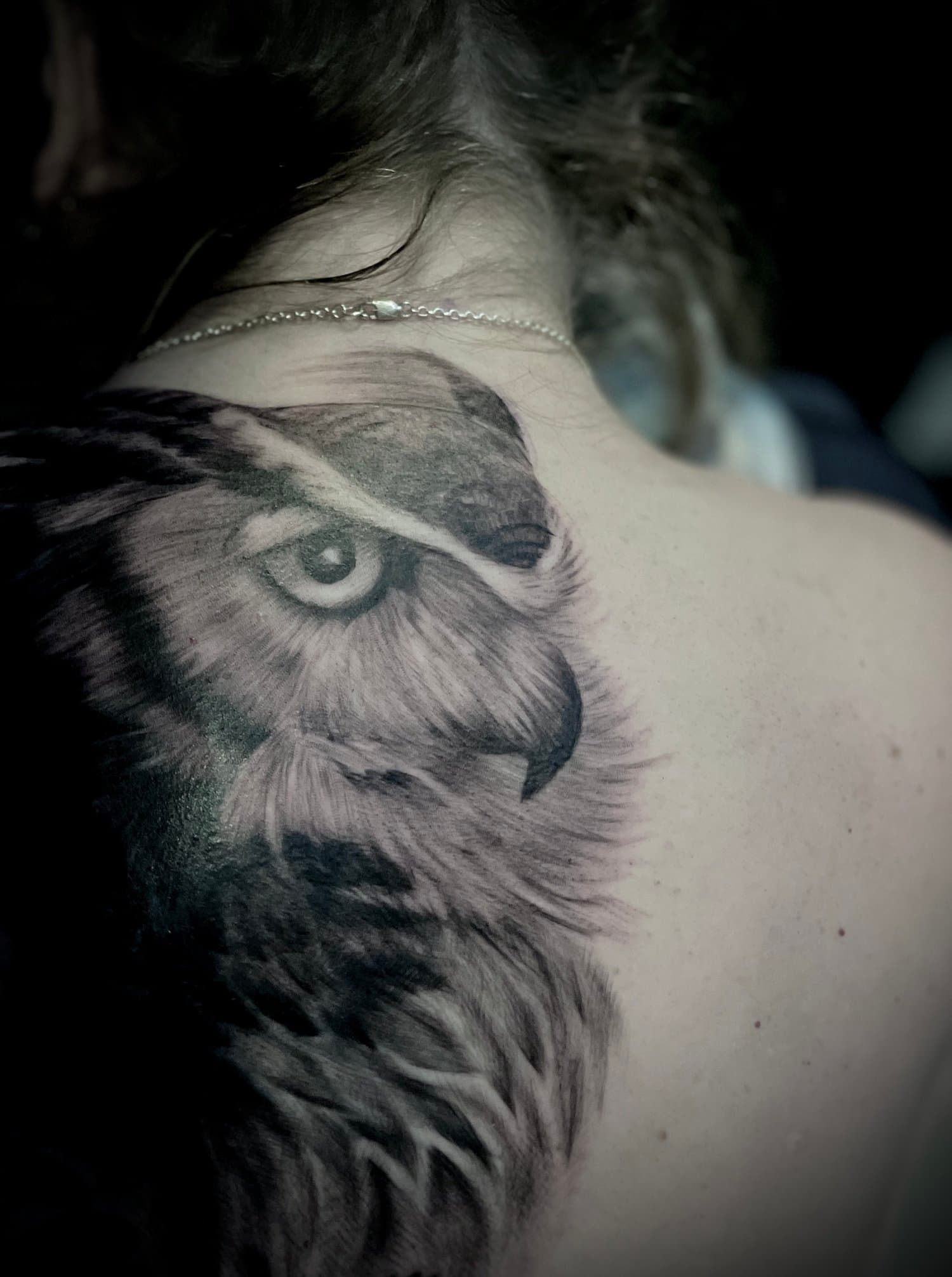 Horned owl tattoo on back