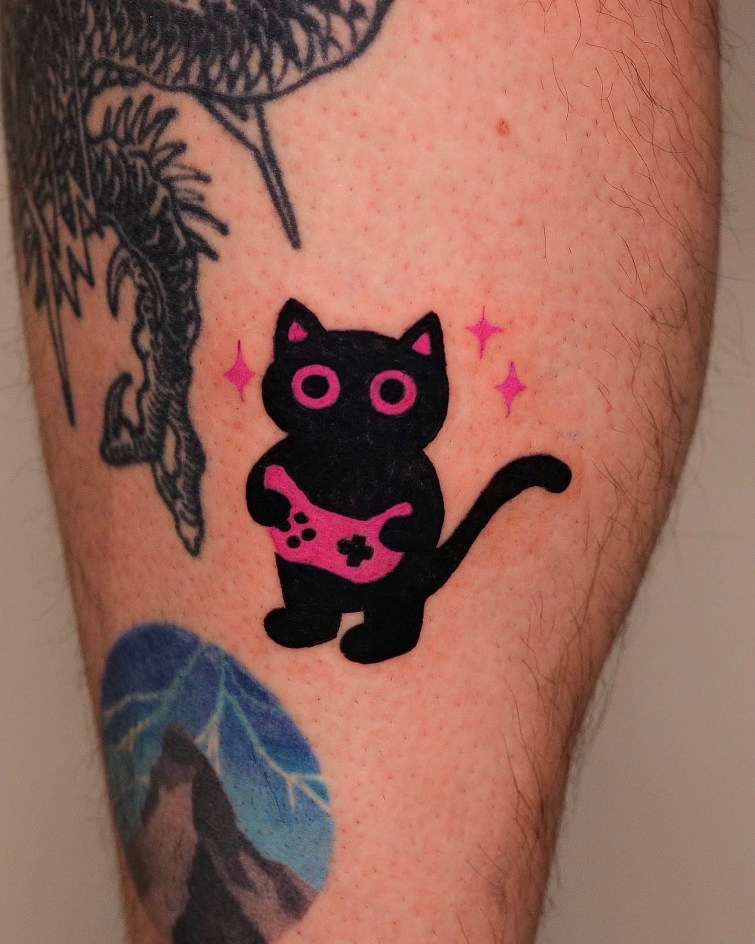 Black cat character holding a pink skull-like face with small sparkle accents