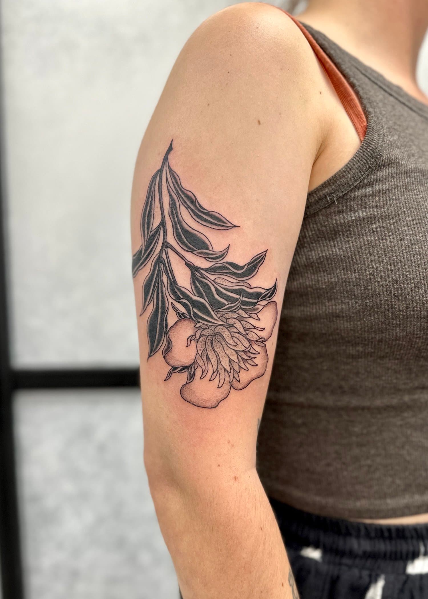 Black work and line work flower tattoo