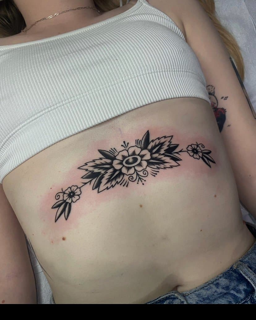 Traditional flowers tattooed by Vancouver tattoo artist Hannah Prive