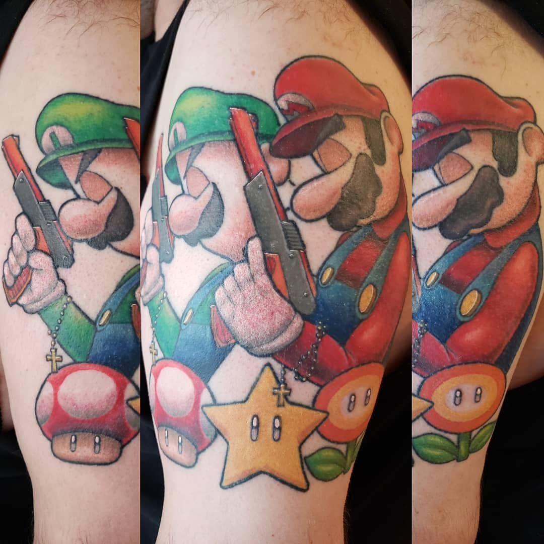 Tattoo of Mario and Luigi posing in the style of the Boondock Saints (Movie).
