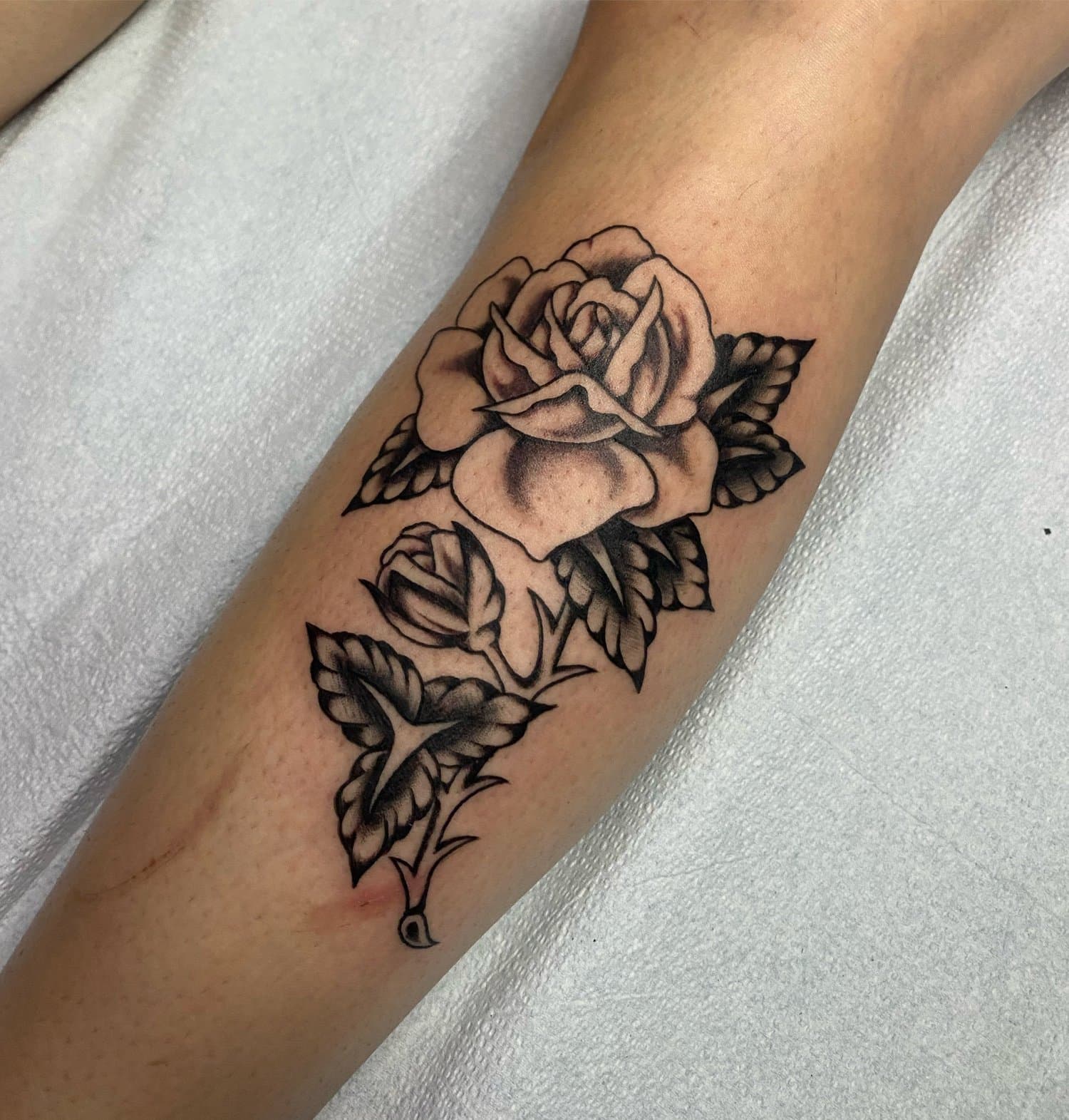 Traditional tattoo rose by Vancouver tattoo artist Hannah Prive
