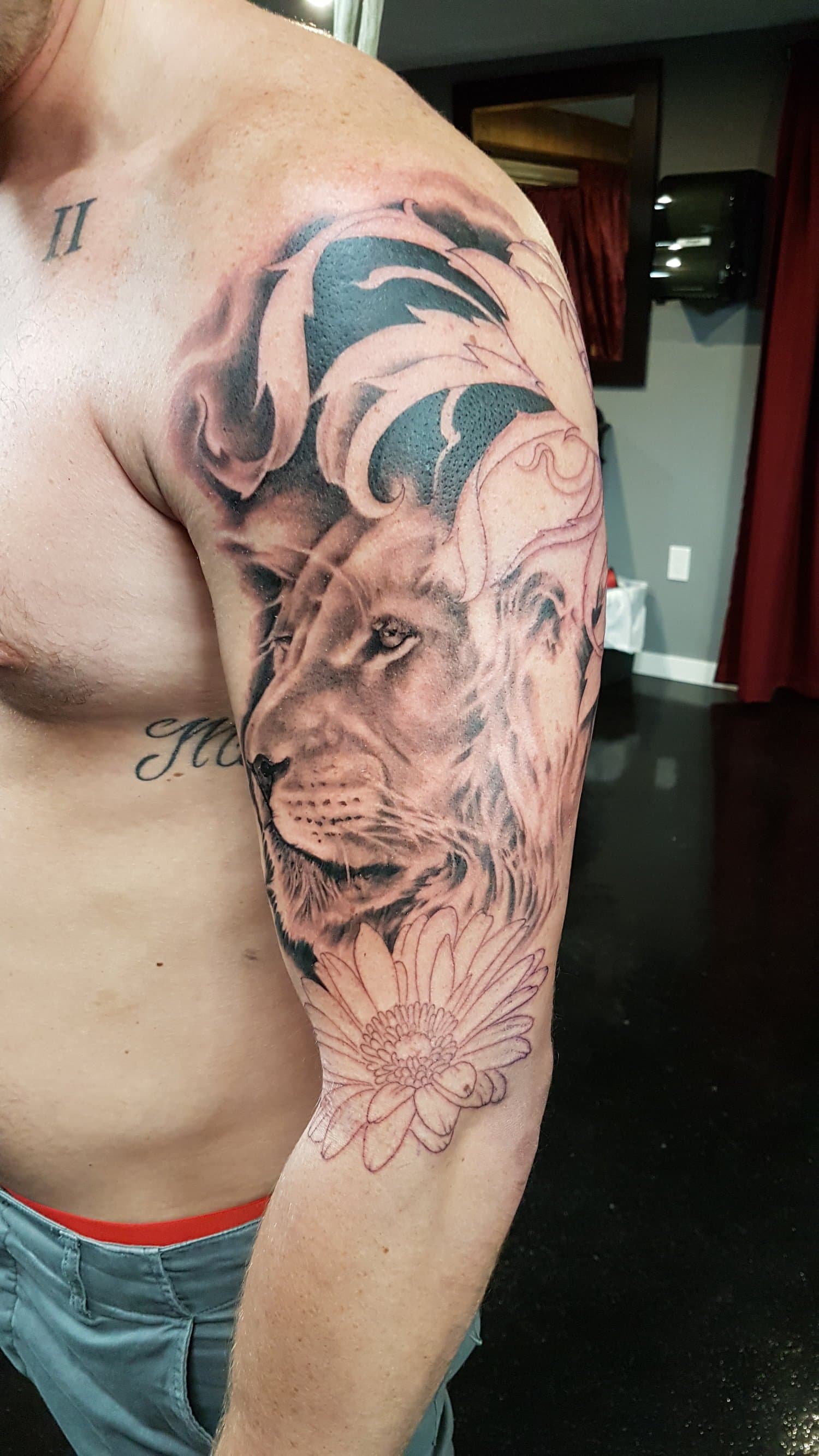 Black-and-grey lion tattoo in Chad Clayton's official work gallery