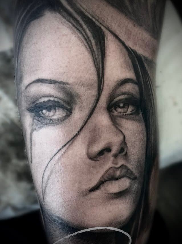 Tattoo of a beautiful face
