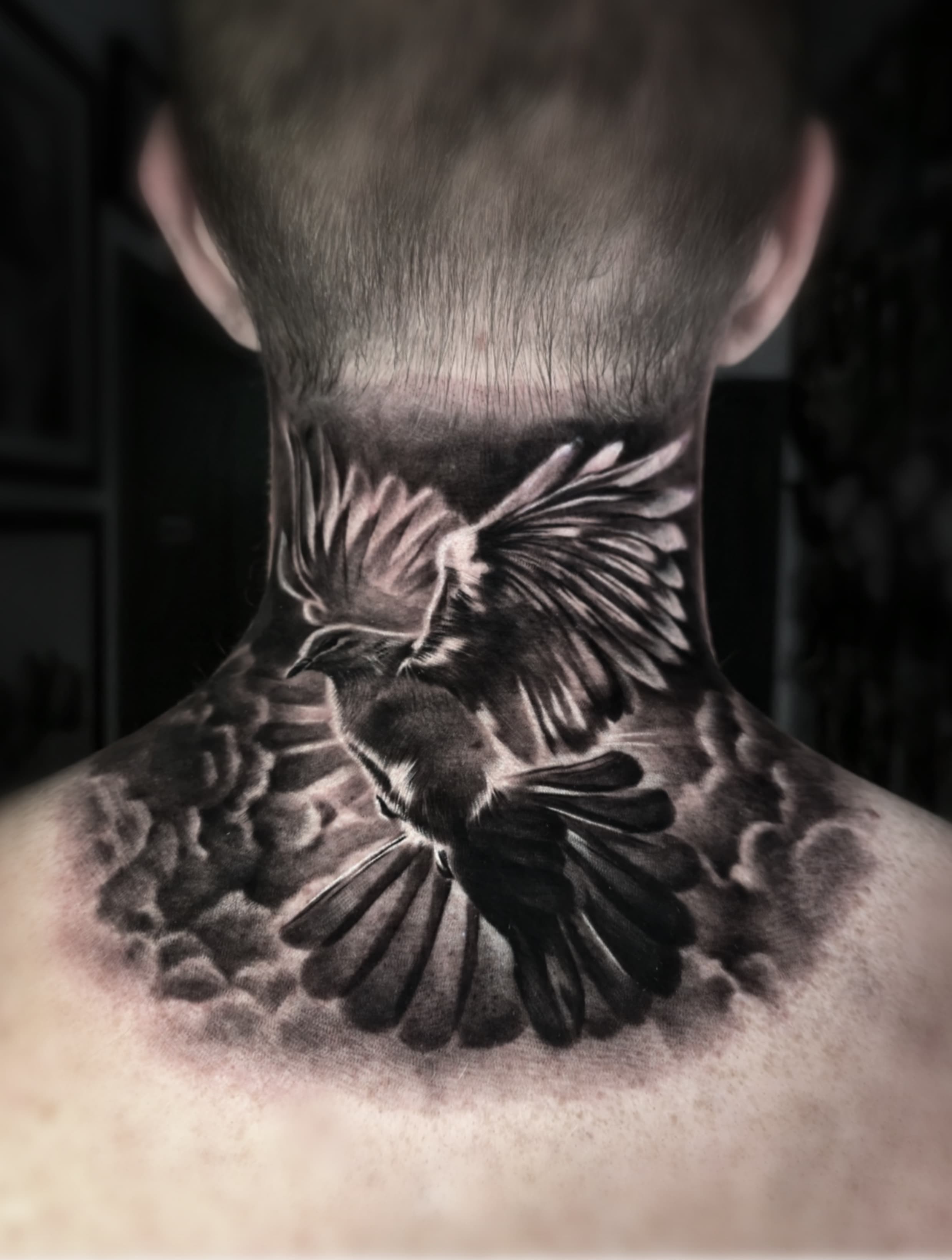 Completed bird neck and upper-back tattoo in Hyunjoo Cho's official portfolio