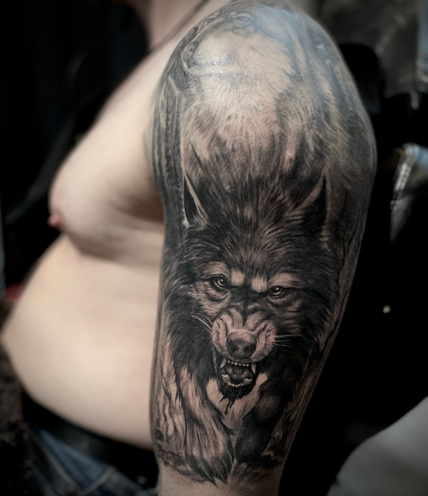 Angry wold half sleeve tattoo