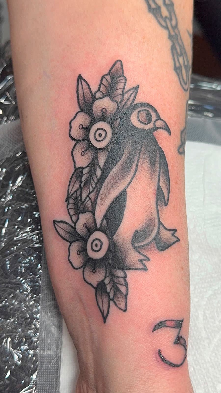 Small penguin tattoo by Harrison Ortega