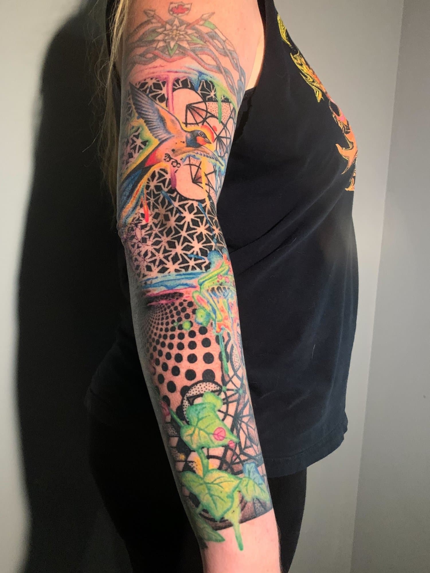 colourful, geometric, abstract arm tattoo