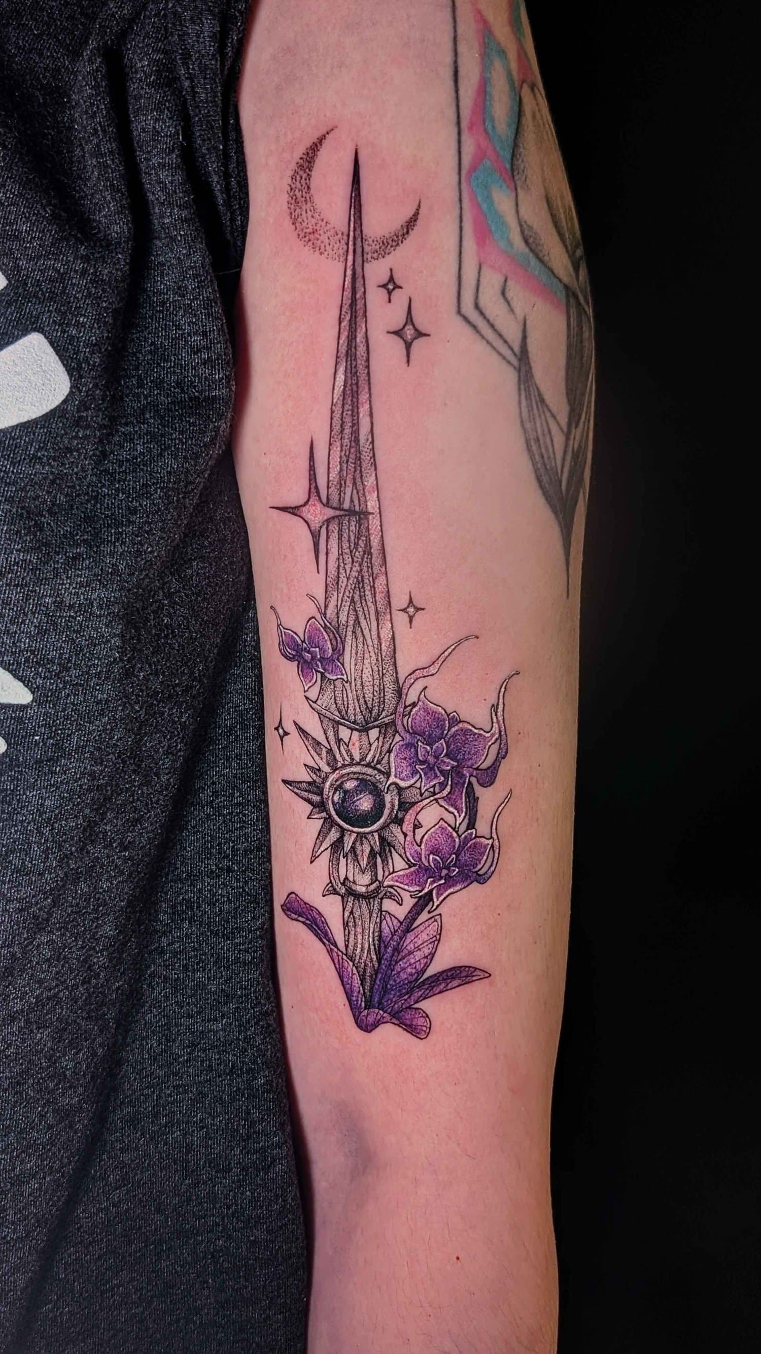 Ornamental sword with purple orchids, a dotted crescent moon, and small stars