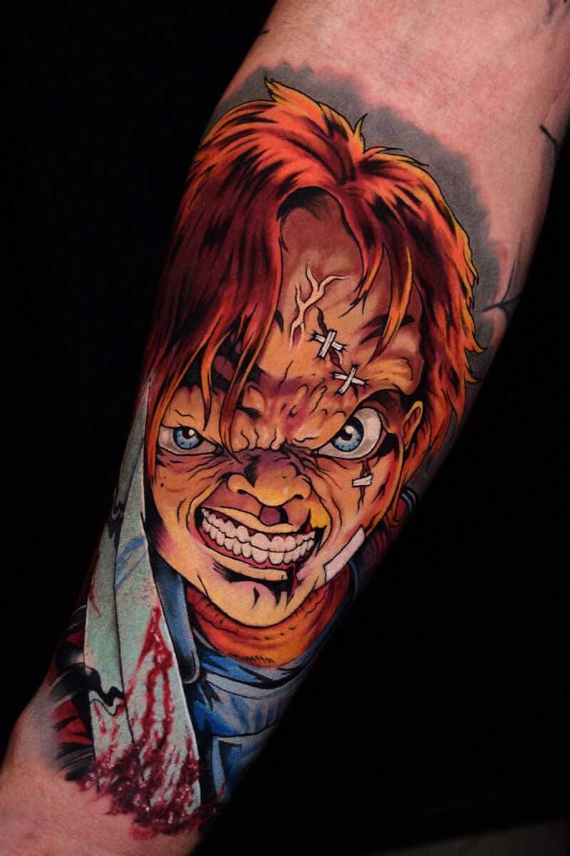 Atticus Tattoo| Cartoon tattoo of Chucky holding a knife