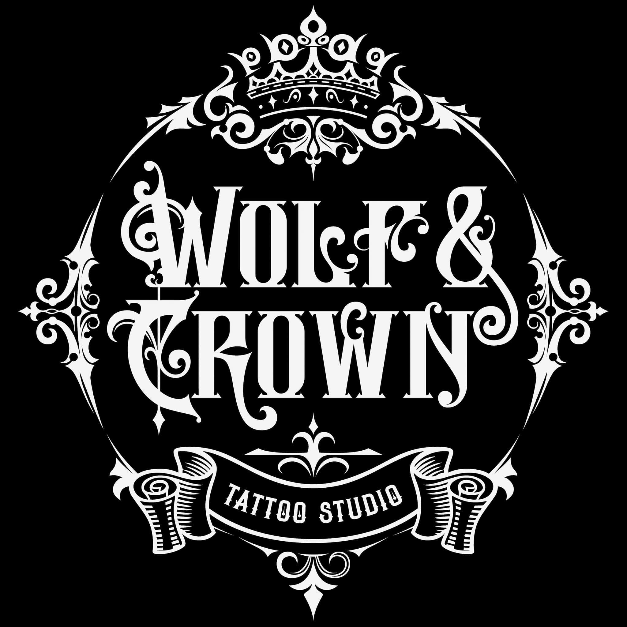 White-on-black Wolf & Crown crest with a crown and a TATTOO STUDIO banner