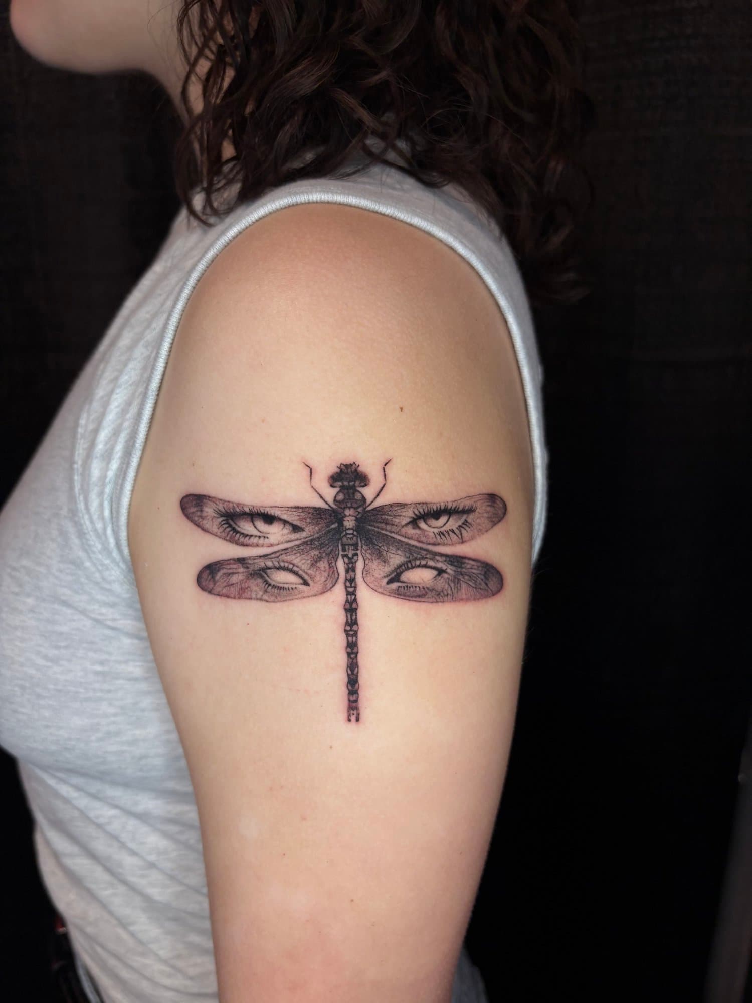 Tattoo of a dragonfly with eyes in the wings. Surrealism Tattoo Done by Pablo at Ink Terminal Ottawa Gatineau