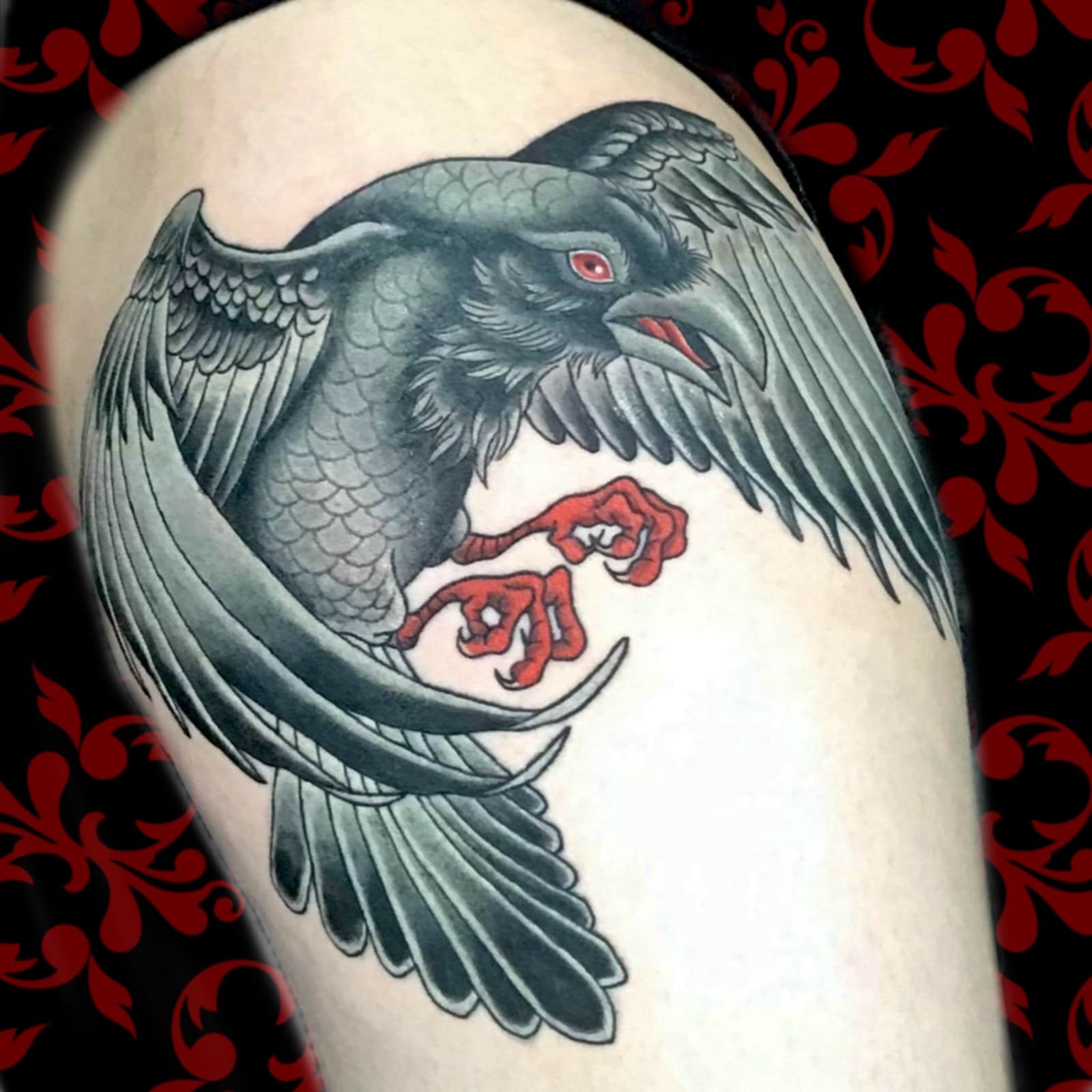 Black Crow flying with claws clenched Jen Black Toronto tattoo artist tattooing out of Lewis Family Tattoo Company 2235A Dundas Street West black crow colour ta