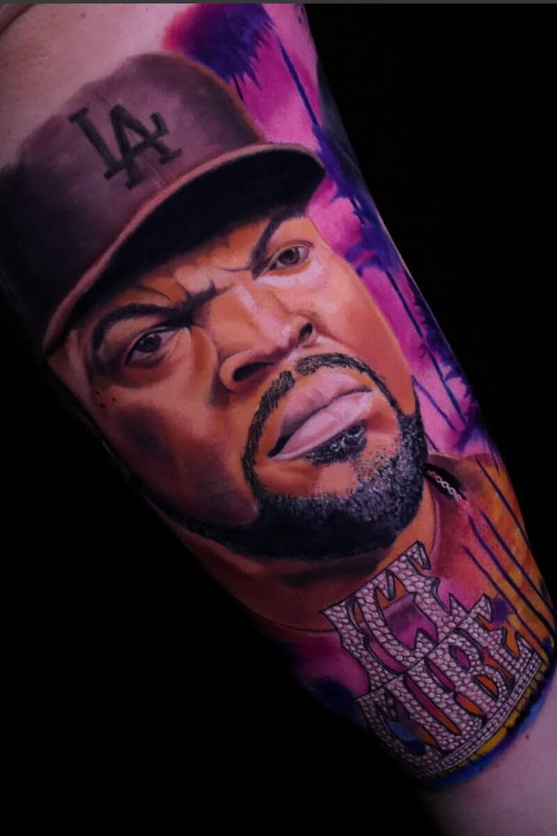 Atticus Tattoo| Colour realism tattoo of Ice Cube with pink sunset background