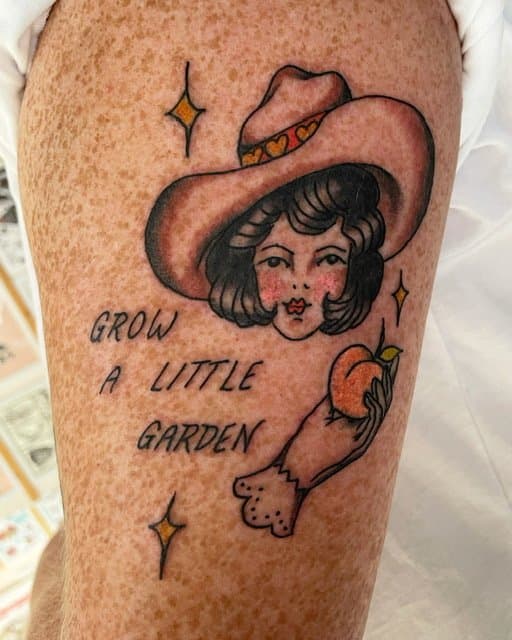 cute, traditional lady head with peach in hand tattoo