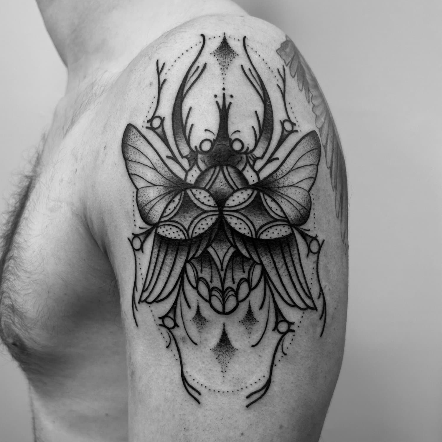black and grey beetle tattoo Toronto