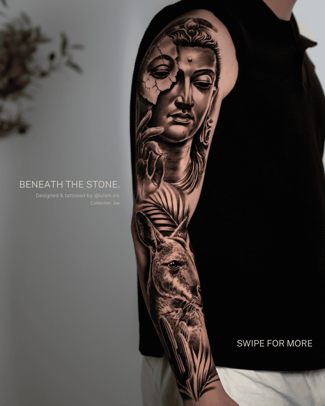 Tattooed arm with a detailed black and gray tattoo of a woman's face and a wolf, featuring floral and abstract elements.