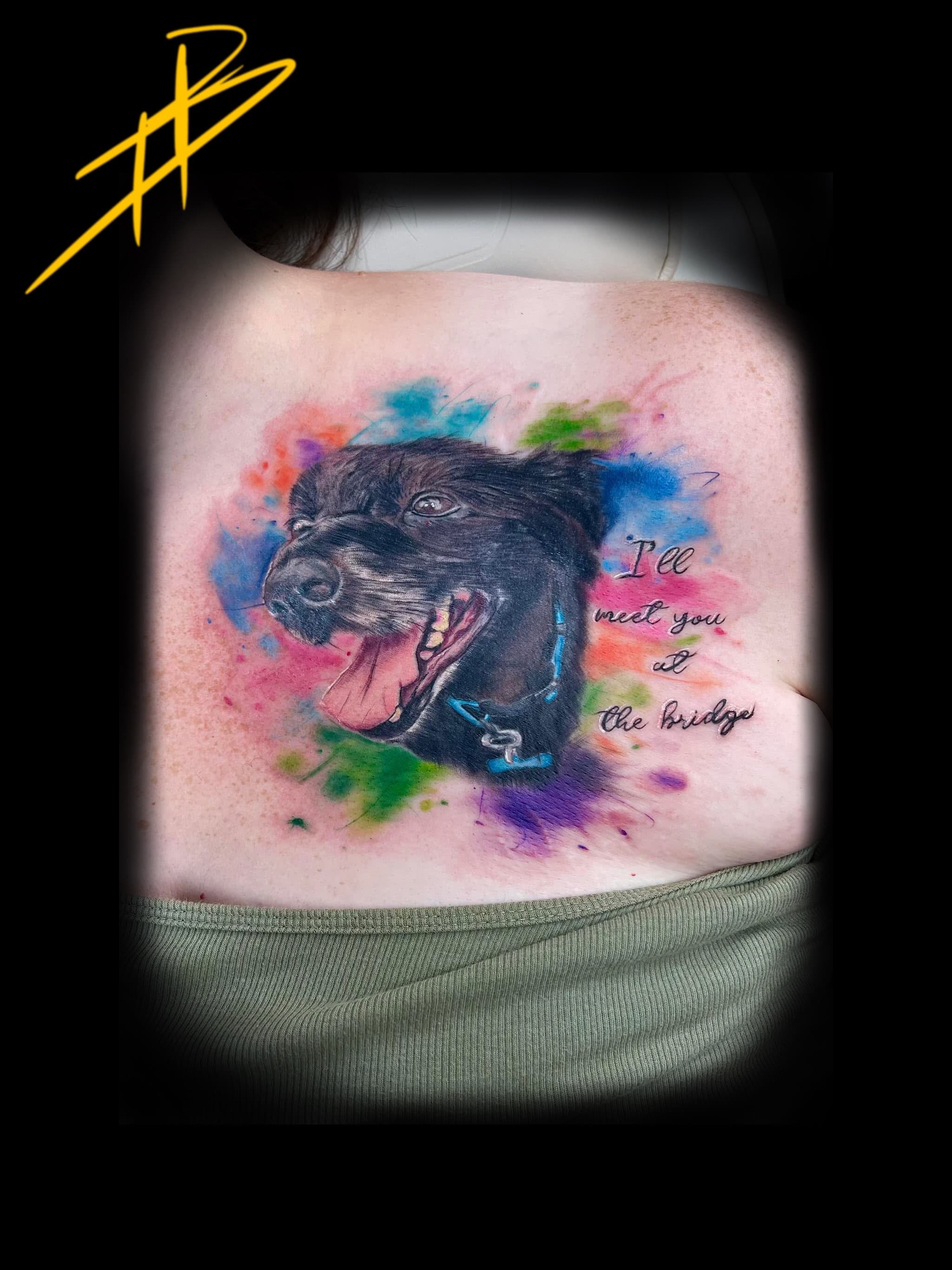 Colour watercolour-style black dog portrait with rainbow splashes and memorial script