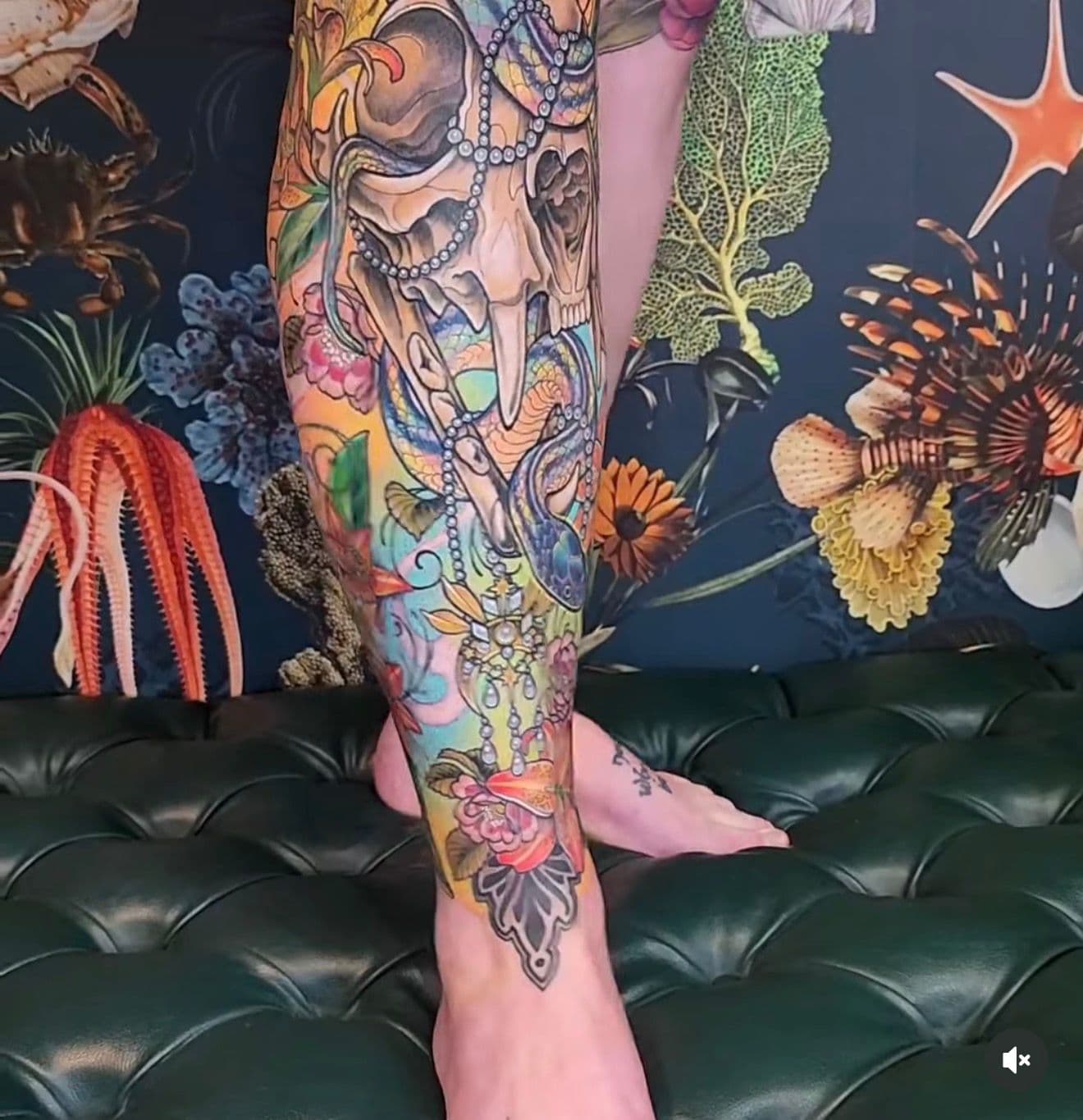 Color leg sleeve tattoo by Hannah Blu featuring skull, snake, pearls, flowers, and ornamental detail
