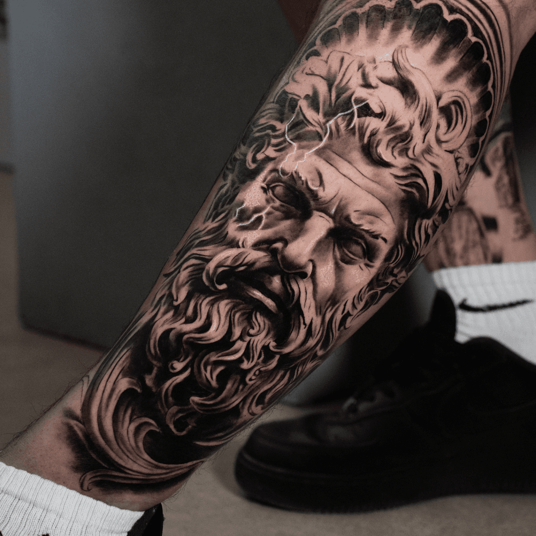 Black and grey realism tattoo of Zeus — large scale Greek mythology sleeve by Luis Fernandez at Zen Tattoo Studio, Oakville. Photorealistic portrait with sculpt