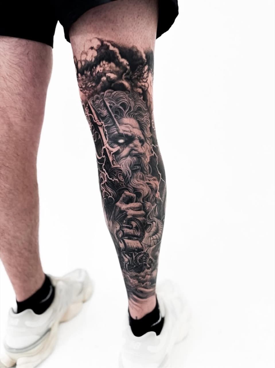 Black and grey realism leg sleeve tattoo at Yes Electric Toronto