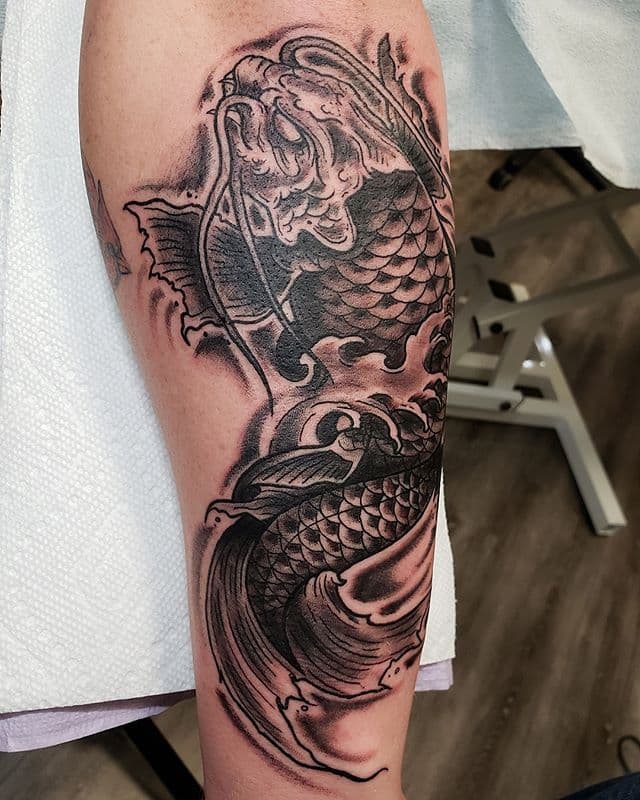 Completed pair of koi tattoos in Devin Chedour's official portfolio
