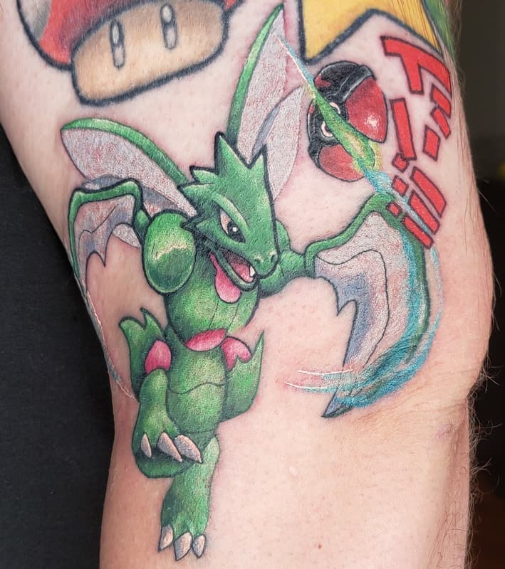 3D tattoo of a shiny Scyther Pokemon.