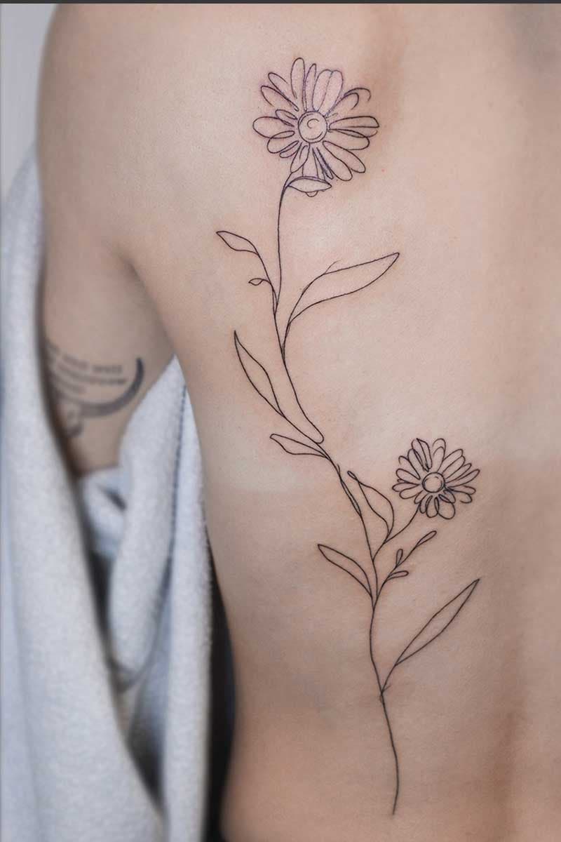 fineline_back_tattoo_daisies